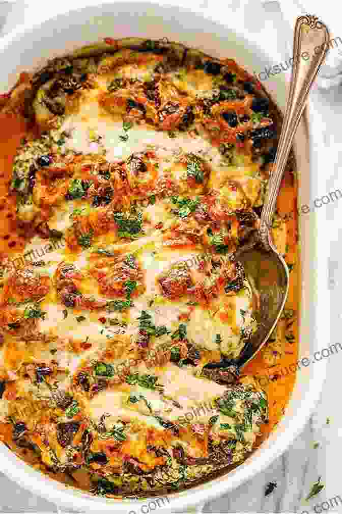 A Golden Brown Casserole Dish Filled With Creamy Tuscan Chicken Casserole, Topped With Melted Cheese. The Dutch Oven Cookbook: Recipes For The Best Pot In Your Kitchen