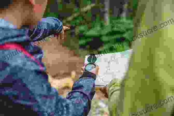 A Hiker Using A Compass In The Wilderness The Natural Navigator Tenth Anniversary Edition: The Rediscovered Art Of Letting Nature Be Your Guide (Natural Navigation)