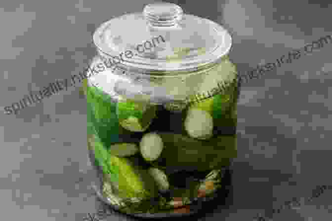 A Photo Of A Person Pickling Cucumbers In A Jar. 52 Unique Techniques For Stocking Food For Preppers: A Strategy A Week To Help Stock Your Pantry For Survival