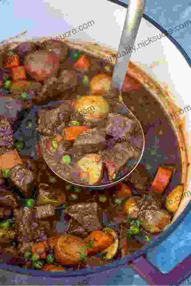 A Steaming Bowl Of Classic Beef Stew, Adorned With Tender Beef, Carrots, And Peas. The Dutch Oven Cookbook: Recipes For The Best Pot In Your Kitchen