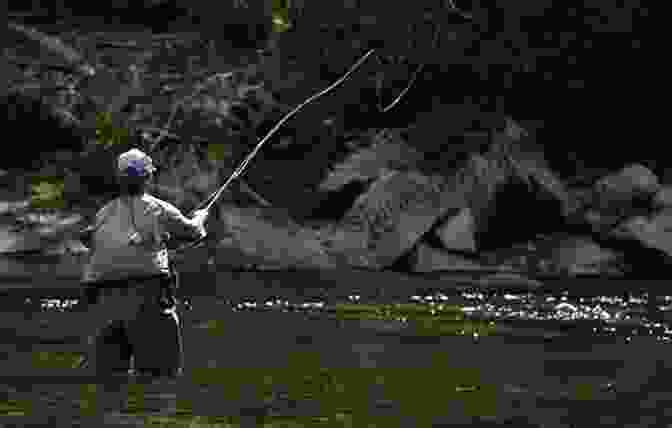 Fly Fisherman Casting A Rod Into A River Reflections Of A Fly Rod